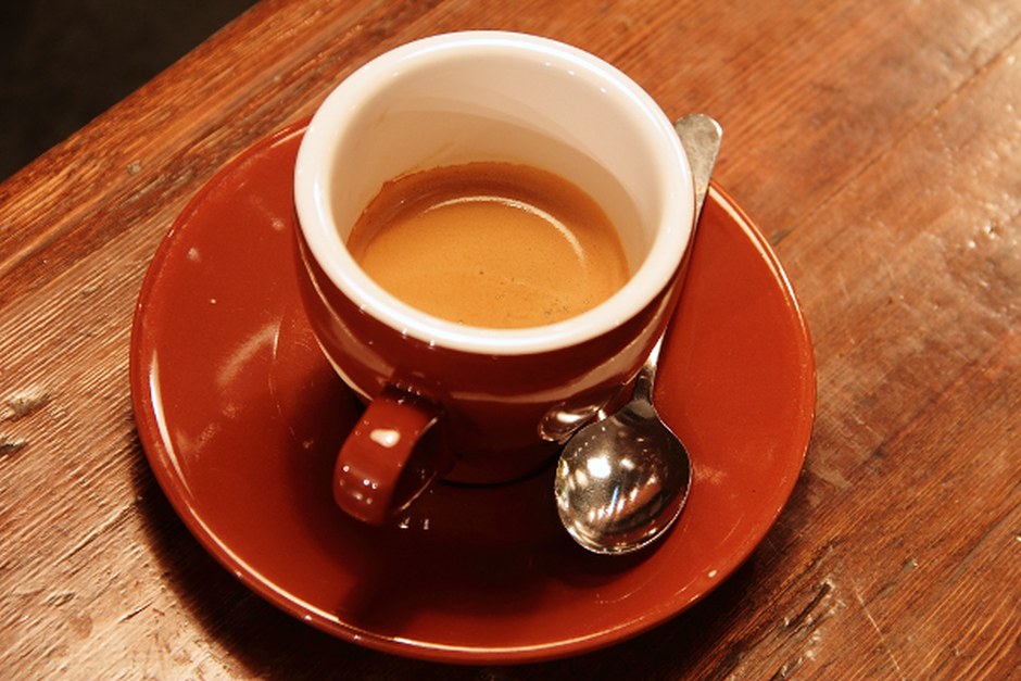 A cup of coffee on a wooden table
